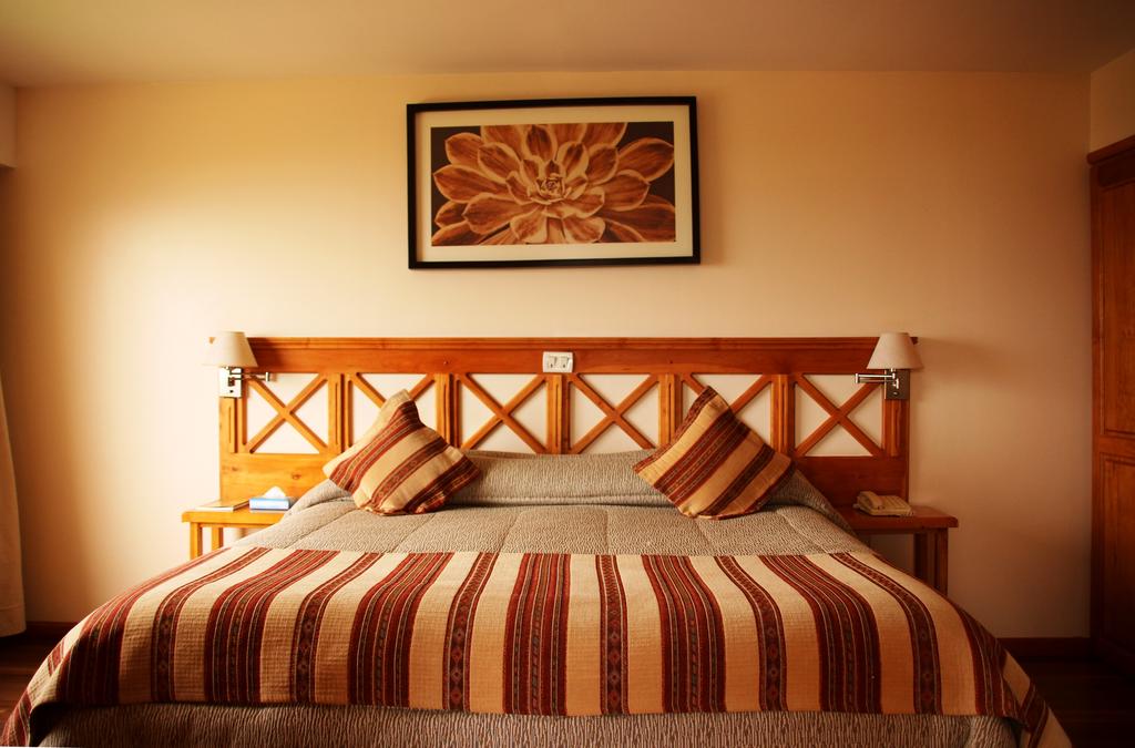 Imagem de um dos quartos do Hotel Altos Ushuaia